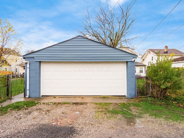 detached garage with fence