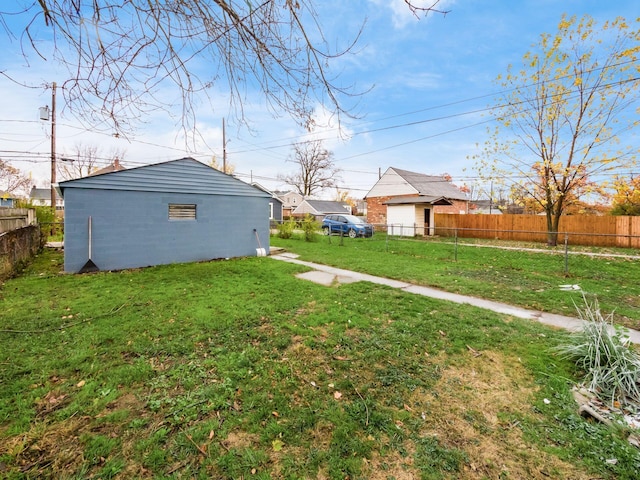 view of yard featuring an outdoor structure and fence private yard