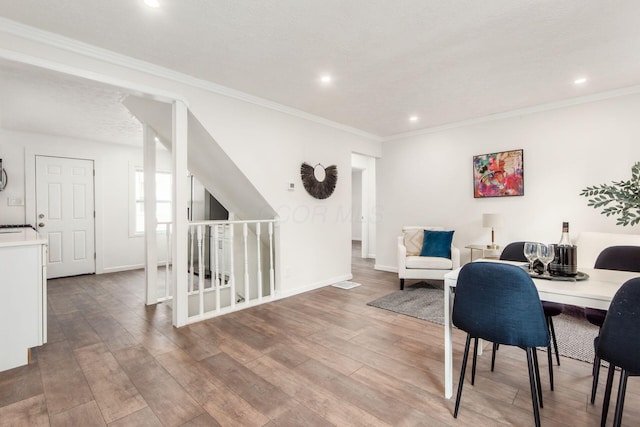 home office featuring ornamental molding, recessed lighting, wood finished floors, and baseboards