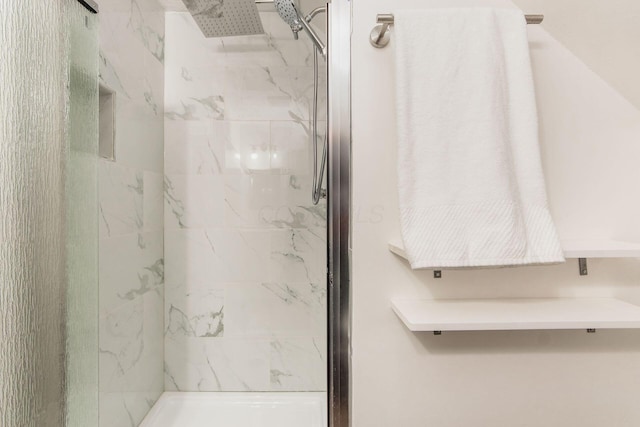 full bathroom featuring a marble finish shower