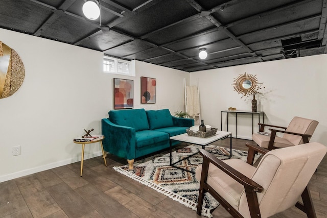 living room featuring baseboards and wood finished floors