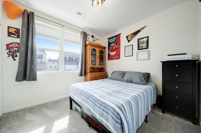 bedroom featuring visible vents and baseboards