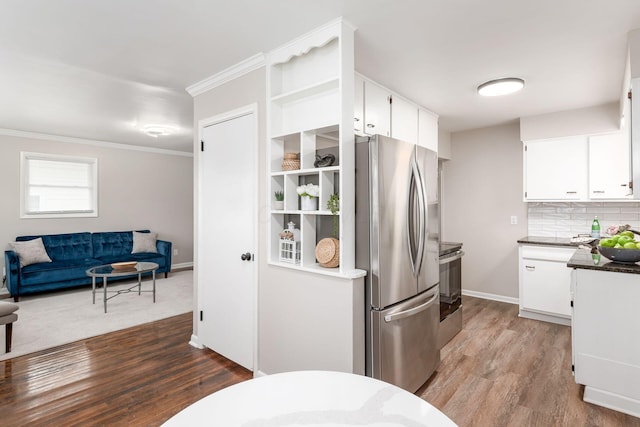 kitchen with open floor plan, appliances with stainless steel finishes, decorative backsplash, dark wood-style floors, and open shelves