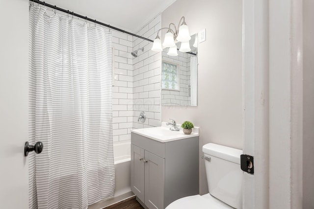 full bath featuring toilet, shower / bath combo with shower curtain, and vanity