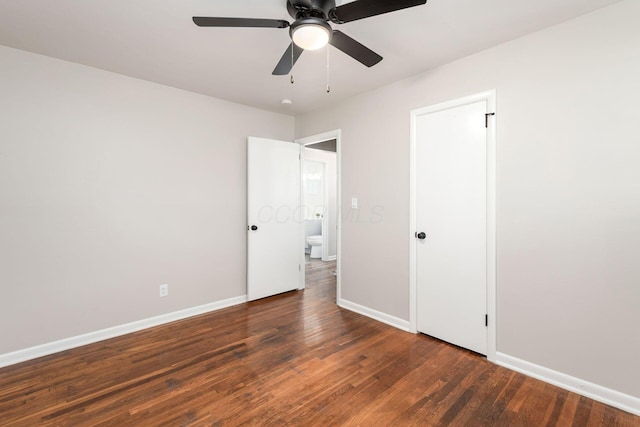 unfurnished bedroom with ceiling fan, baseboards, and wood finished floors