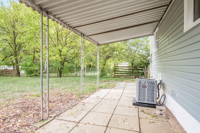 view of patio / terrace featuring cooling unit and fence