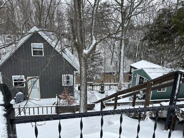 view of snow covered house