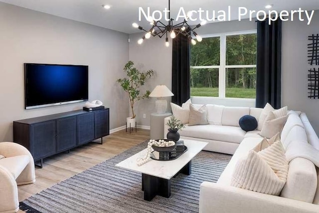 177 Reneau Ave Lot 42, Galloway, OH 43119 - living room featuring recessed lighting, baseboards, an inviting chandelier, and light wood-style floors