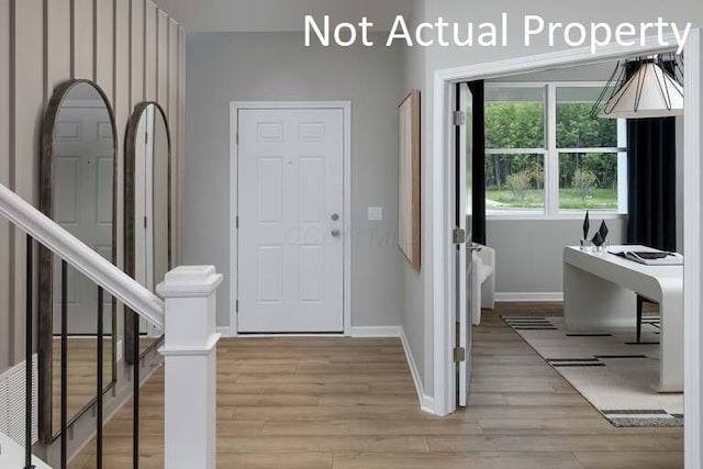 177 Reneau Ave Lot 42, Galloway, OH 43119 - entrance foyer with baseboards, stairs, and light wood-style flooring