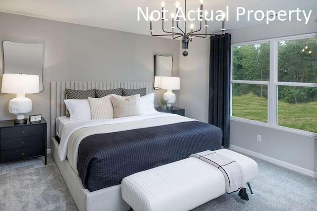 177 Reneau Ave Lot 42, Galloway, OH 43119 - bedroom featuring baseboards, a chandelier, and carpet