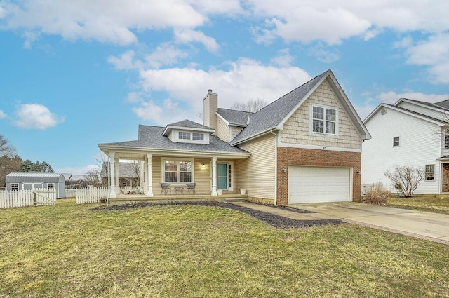 view of front of house with driveway, a porch, a front yard, and fence