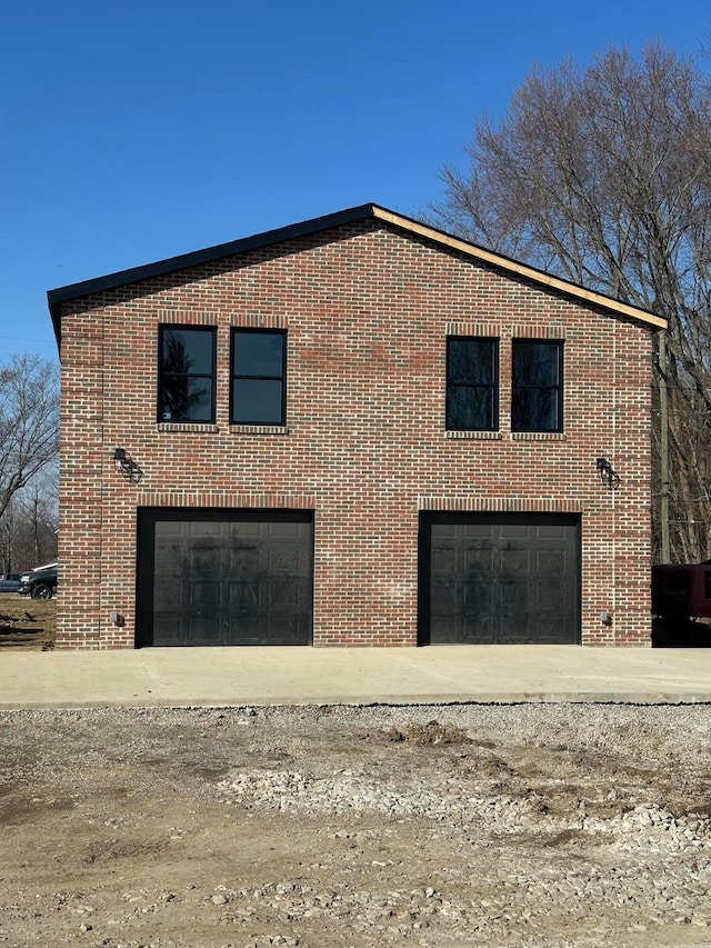 view of side of property featuring brick siding