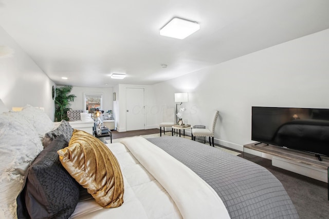 carpeted bedroom featuring baseboards