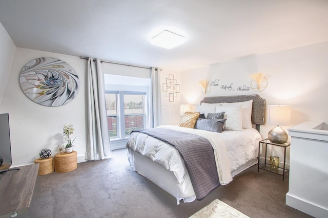 bedroom featuring carpet and baseboards