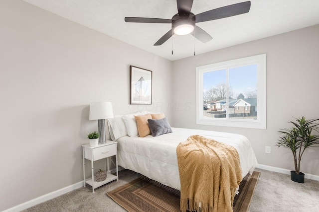 bedroom with carpet floors, ceiling fan, and baseboards