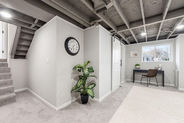 basement featuring baseboards, stairway, and light colored carpet