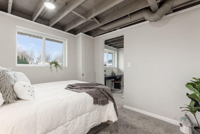 bedroom with carpet floors and baseboards