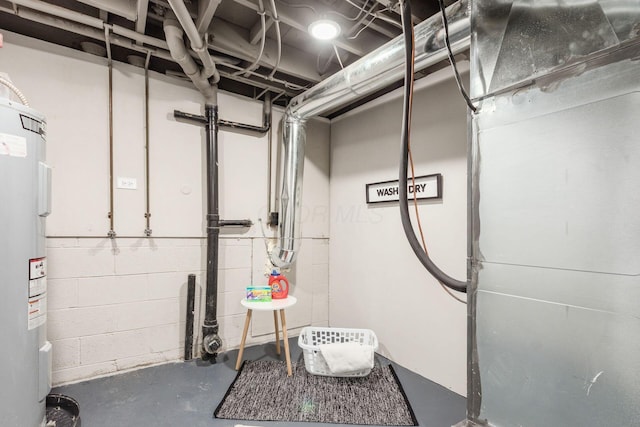 unfinished basement with concrete block wall and water heater