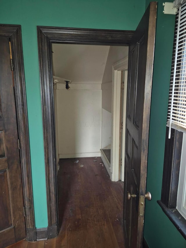 corridor featuring wood finished floors