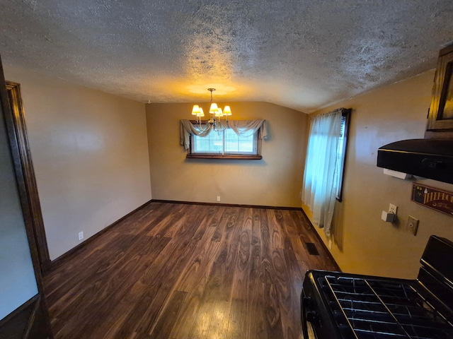 unfurnished dining area with baseboards, lofted ceiling, dark wood-style flooring, an inviting chandelier, and a textured ceiling