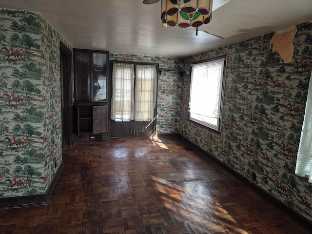 empty room featuring baseboards