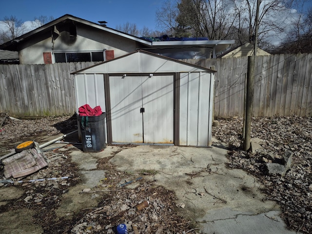 view of shed featuring a fenced backyard