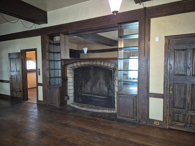 details featuring a fireplace and wood finished floors