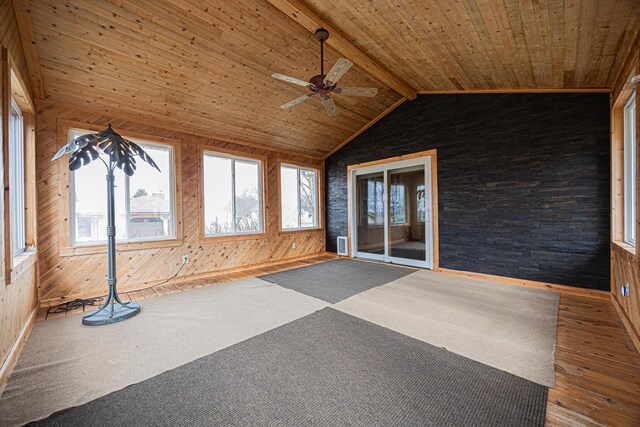 unfurnished sunroom with lofted ceiling with beams, wooden ceiling, and a ceiling fan