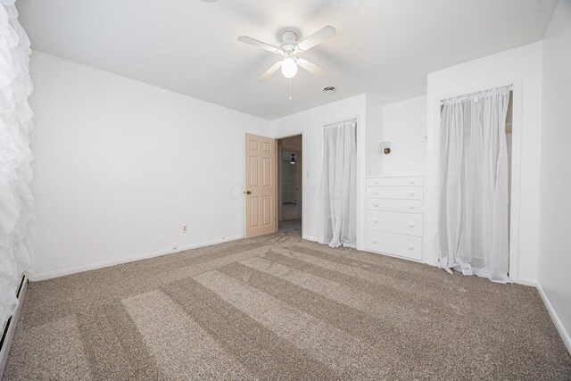 unfurnished bedroom with carpet floors, ceiling fan, and baseboards