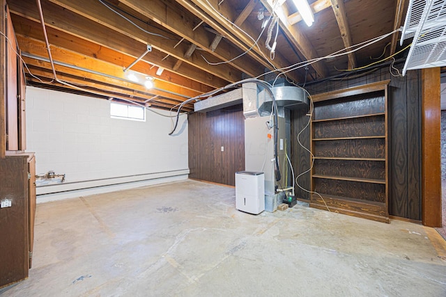 basement featuring a baseboard heating unit