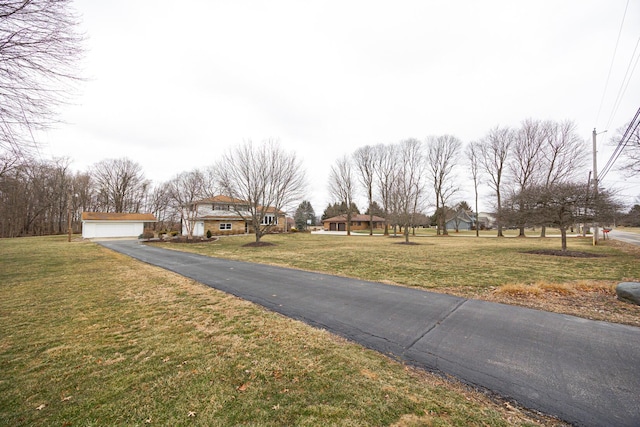 view of street featuring aphalt driveway