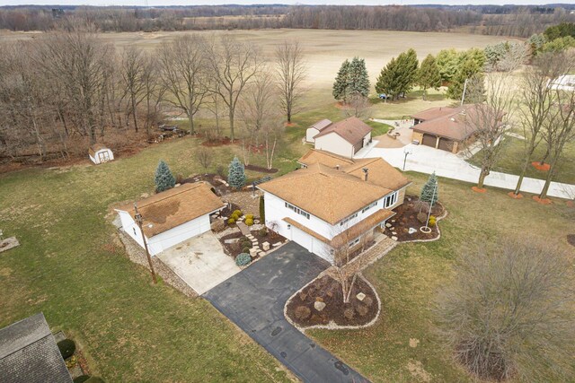 birds eye view of property with a rural view