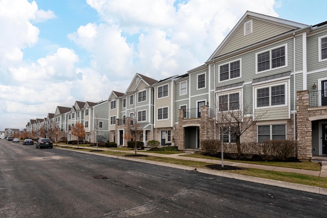 view of road with sidewalks and a residential view