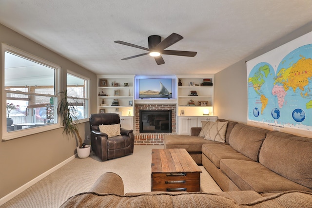 carpeted living area featuring built in features, a brick fireplace, baseboards, and a textured ceiling