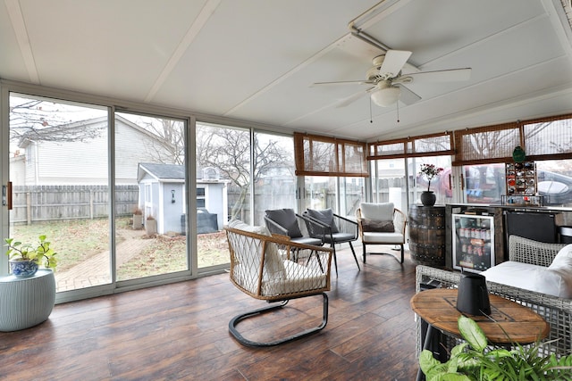 sunroom / solarium with beverage cooler and a ceiling fan