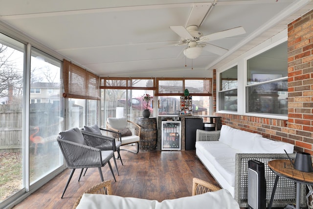 sunroom / solarium featuring a ceiling fan and wine cooler