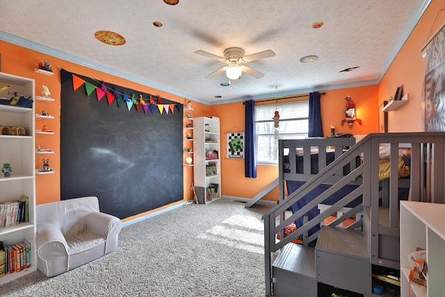 carpeted bedroom with a textured ceiling, ornamental molding, and baseboards