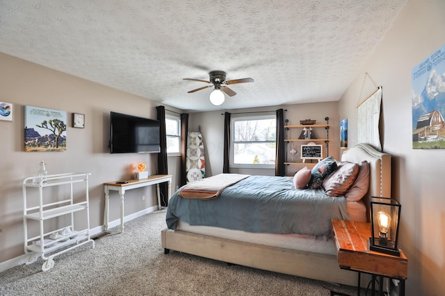 bedroom with ceiling fan, a textured ceiling, baseboards, and carpet flooring