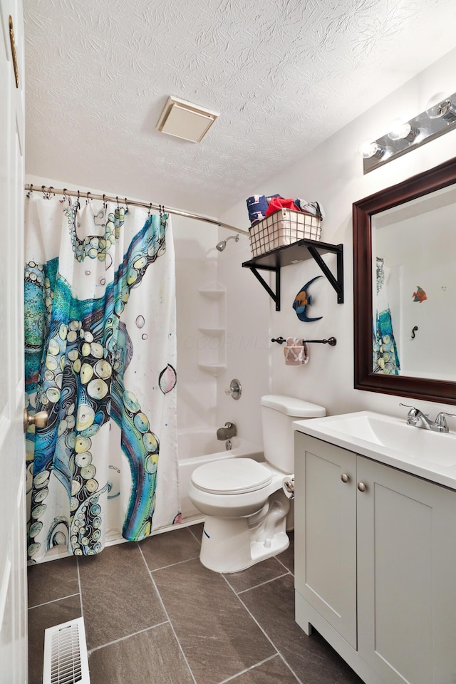 bathroom featuring toilet, vanity, shower / bath combo with shower curtain, and tile patterned floors