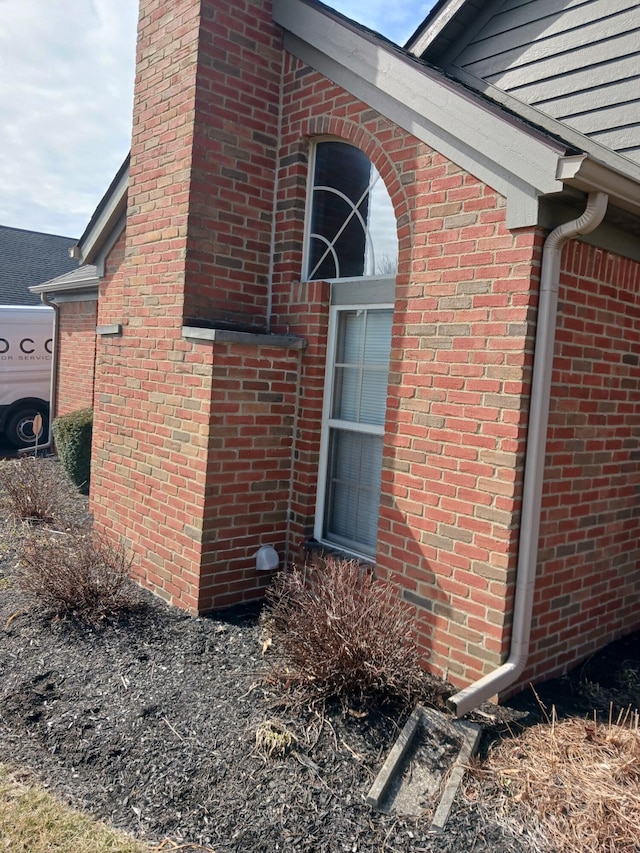 view of home's exterior featuring brick siding