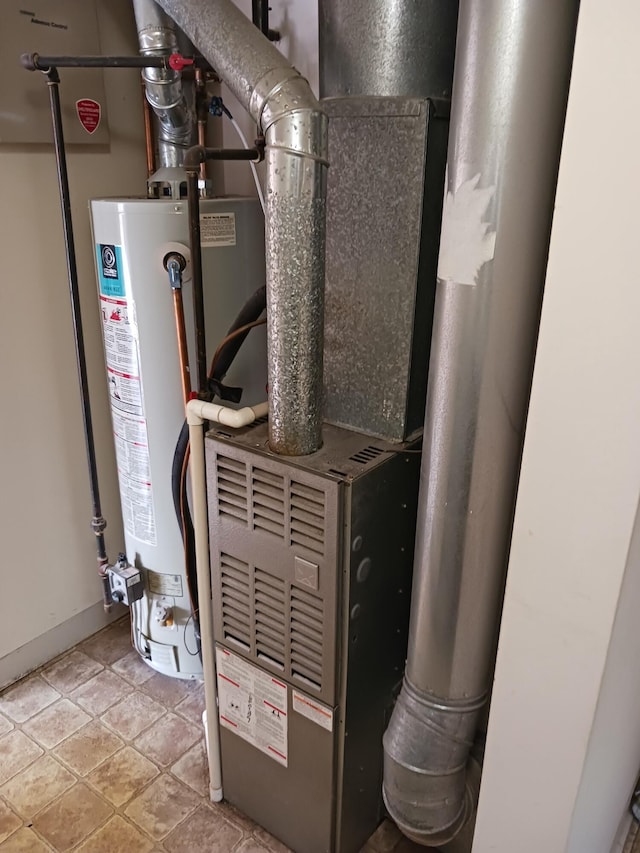 utility room with water heater