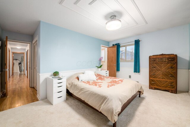 carpeted bedroom featuring a closet