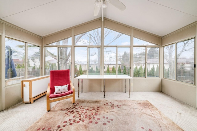 sunroom / solarium featuring a ceiling fan and vaulted ceiling