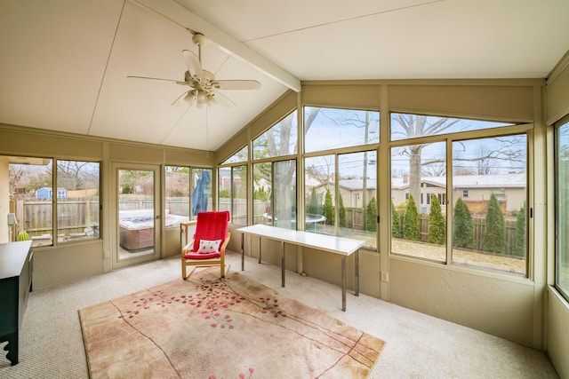 sunroom with lofted ceiling with beams and ceiling fan