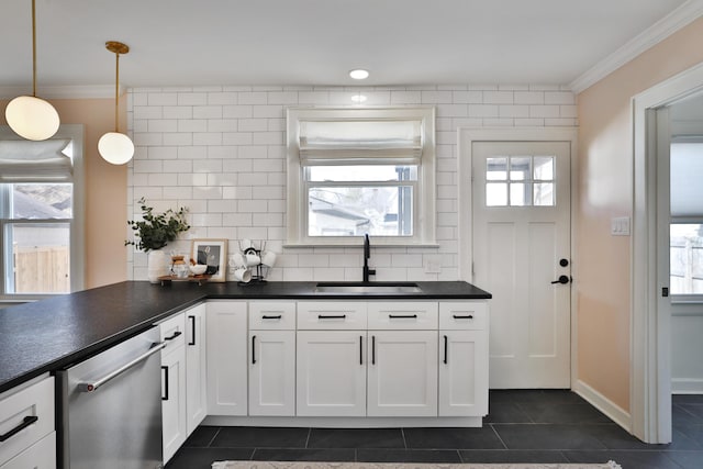 kitchen featuring dark countertops, a sink, backsplash, and dishwasher