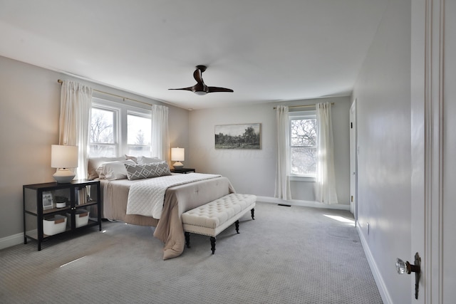 bedroom featuring a ceiling fan, carpet flooring, and baseboards