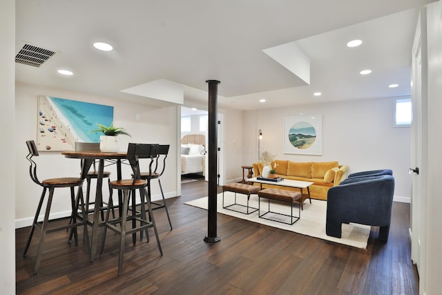 dining room with baseboards, visible vents, wood finished floors, and recessed lighting