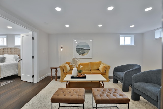 living room with baseboards, dark wood-type flooring, and recessed lighting