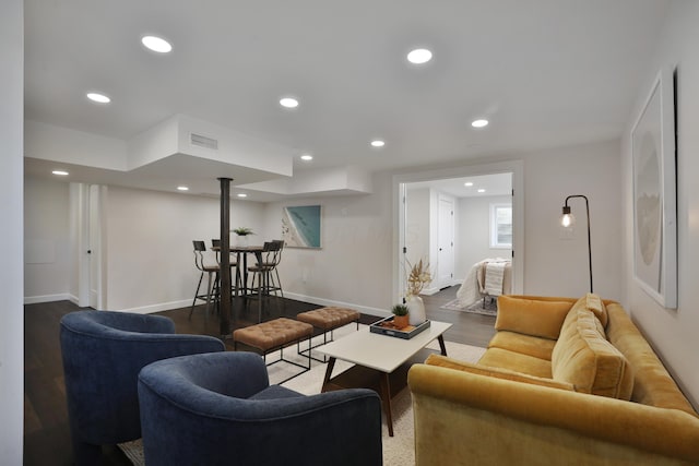 living room featuring recessed lighting, visible vents, and wood finished floors