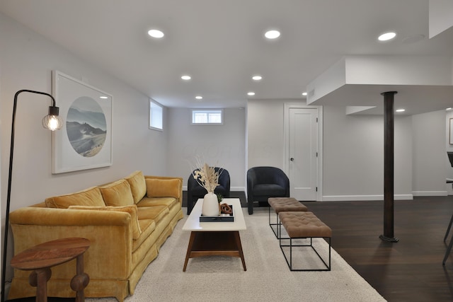 living area featuring baseboards, wood finished floors, and recessed lighting